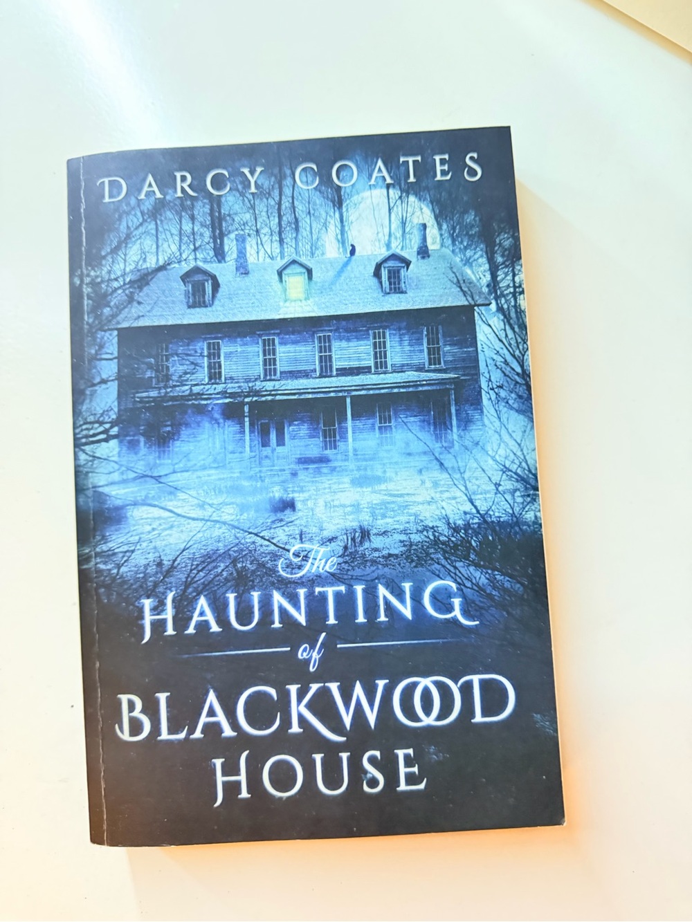 The Haunting of Blackwood House by Darcy Coates — Blue Cover Paperback